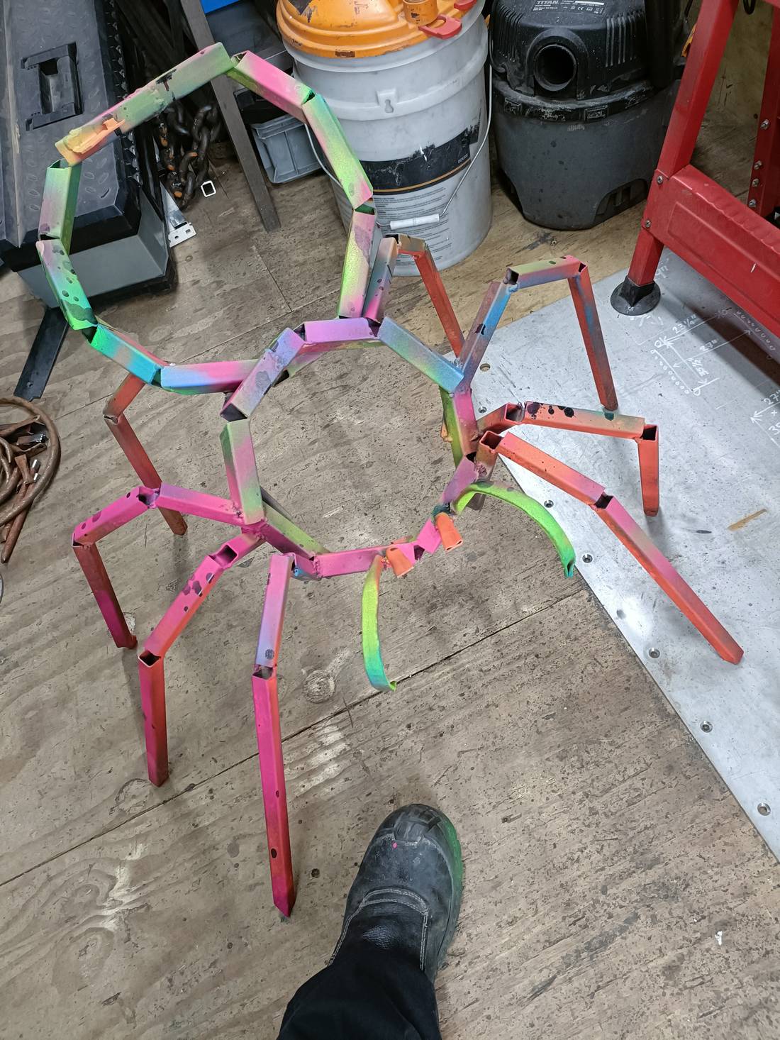 Painted spider on the workshop floor